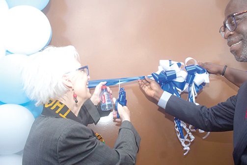 Ellen Moran (left) and  William Owuraku Aidoo, Deputy Minister of Energy, cutting a tape at the inauguration of the Ellen Morgan primary substation at Kanda
